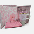 NCHIMBA LoveShackFancy stainless steel tumbler gift set with pink floral ribbon motif, straw, and carrying pouch.